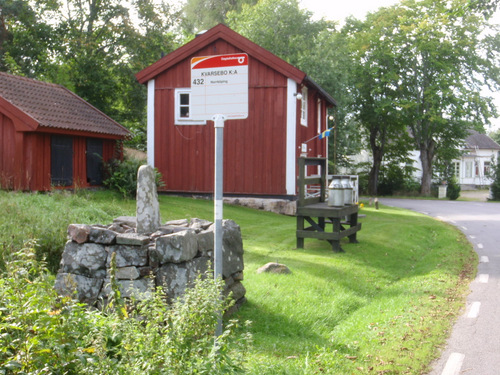 Milk Cans, Old Distance Marker, and Bus Stop.